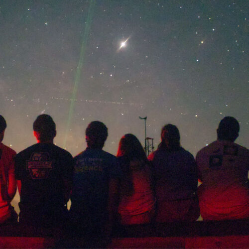 students observing night sky