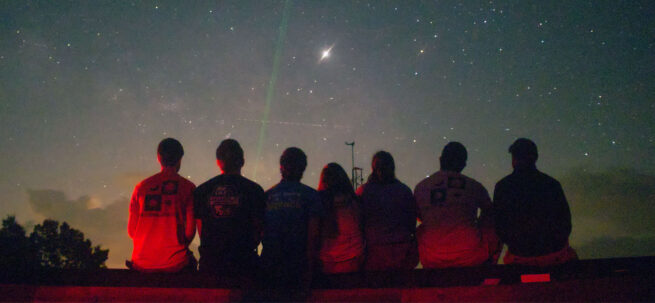 students observing night sky